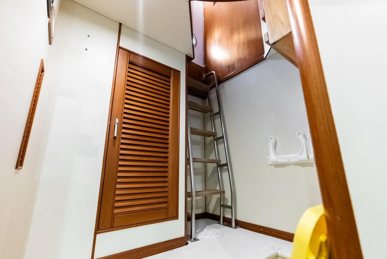 A cozy interior space featuring a ladder leading to an upper level. aboard EL LEGADO Yacht for Sale