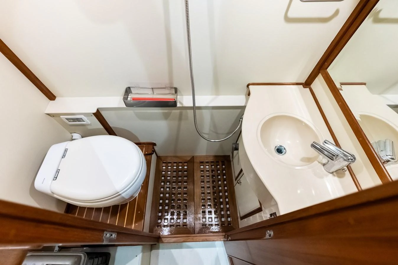 The yacht's head features a compact and efficient design with modern fixtures. aboard EL LEGADO Yacht for Sale