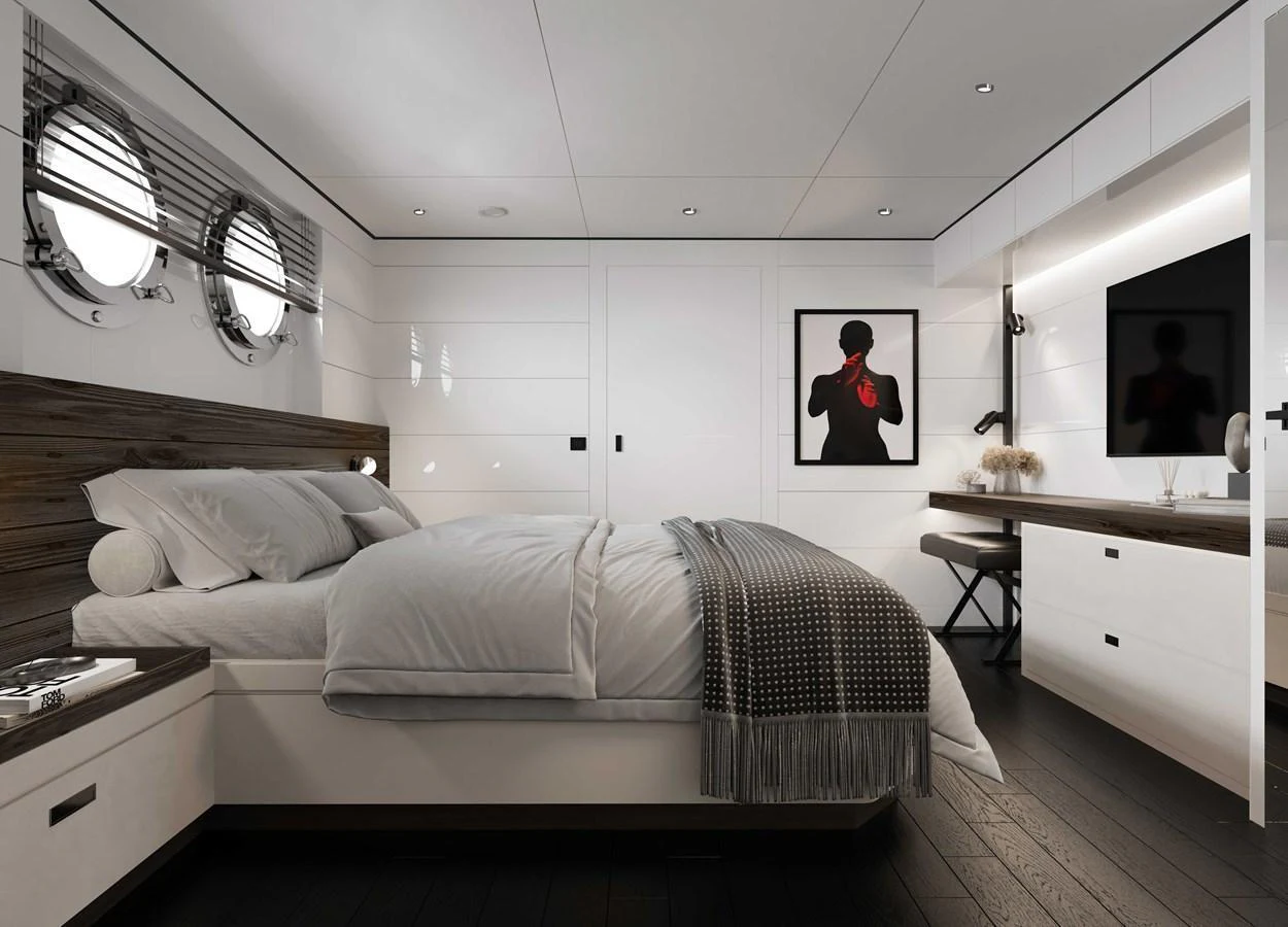 A luxurious stateroom featuring a comfortable bed, modern decor, and ample natural light. aboard MAKO SHARK Yacht for Sale