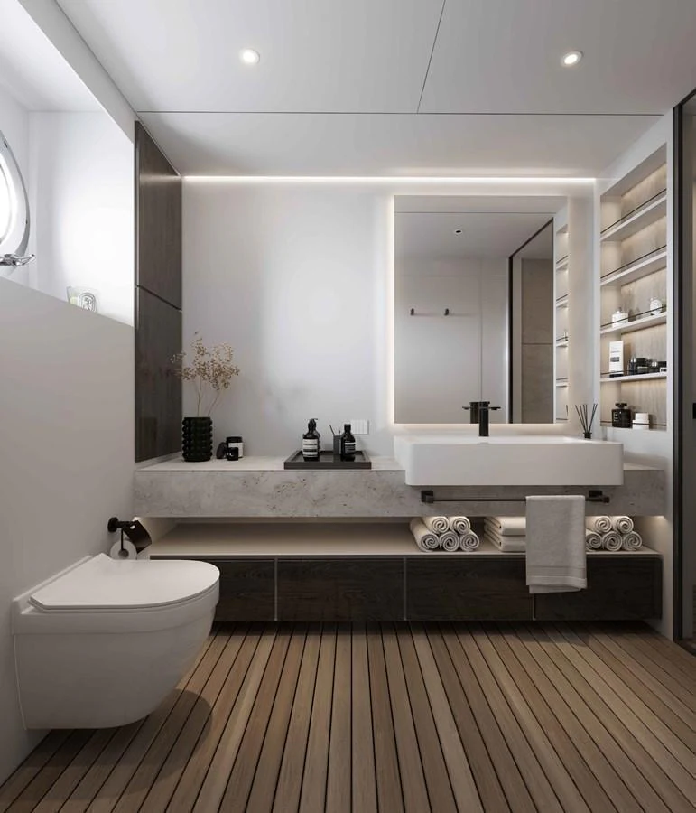 A modern and luxurious yacht bathroom with sleek fixtures and ample storage. aboard MAKO SHARK Yacht for Sale