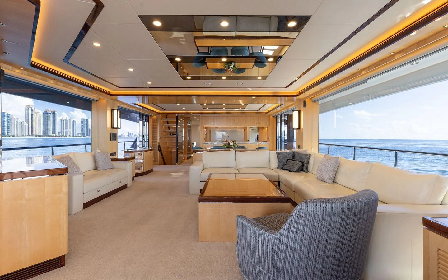The spacious salon offers luxurious seating with panoramic views of the ocean. aboard WADDLE WE DO Yacht for Sale