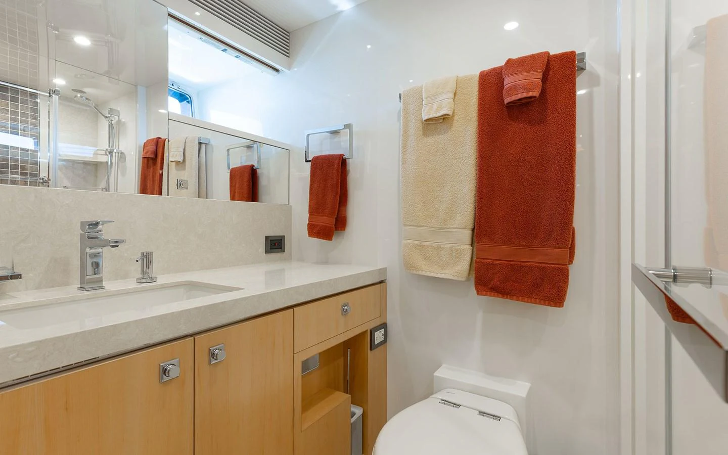 The yacht's bathroom features modern fixtures and a clean, bright design. aboard WADDLE WE DO Yacht for Sale