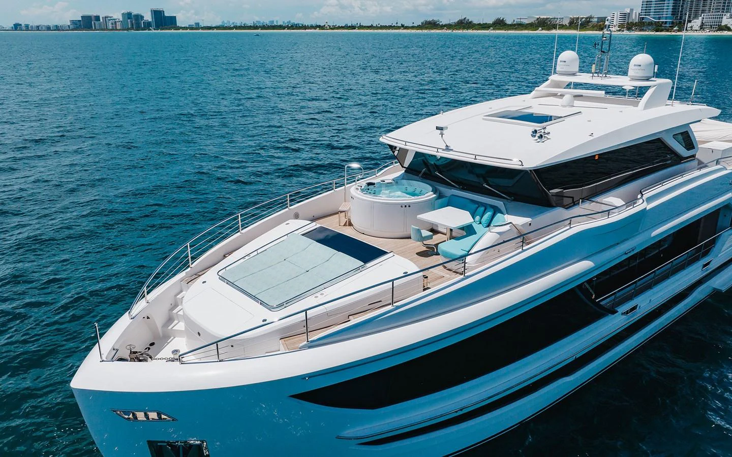 A sleek and modern yacht cruising on calm blue waters with a spacious deck and luxurious amenities. aboard WADDLE WE DO Yacht for Sale