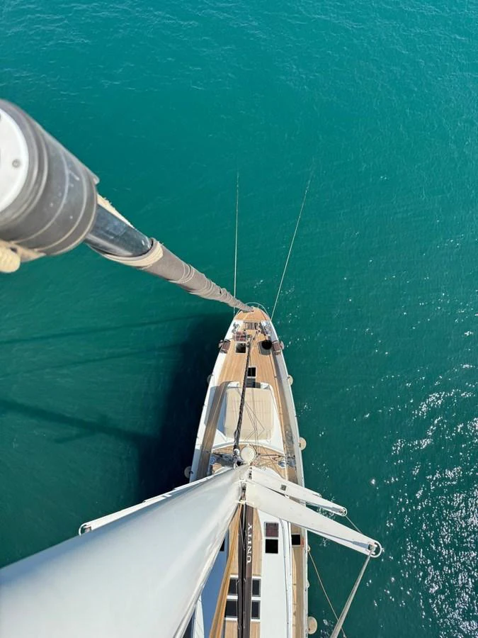 A stunning aerial view of a sailing yacht on clear blue waters. aboard 23 M MOTORSAILOR Yacht for Sale