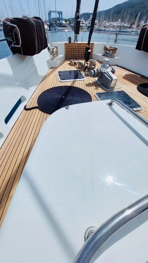 The foredeck features a clean, spacious layout with essential equipment and a teak deck. aboard 23 M MOTORSAILOR Yacht for Sale