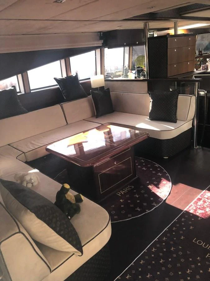 The salon features a luxurious seating area with plush cushions and a stylish coffee table, creating a cozy and elegant atmosphere. aboard 23 M MOTORSAILOR Yacht for Sale
