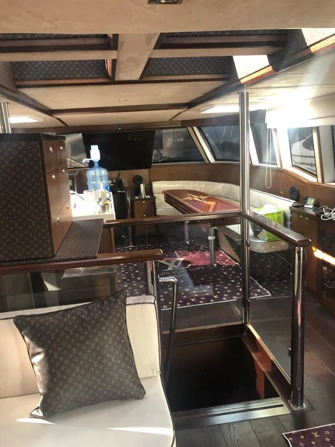 The yacht's interior features a luxurious and well-lit living space with elegant furnishings and modern amenities. aboard 23 M MOTORSAILOR Yacht for Sale