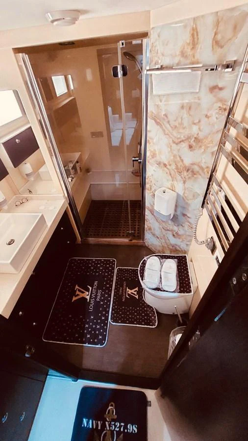 The yacht's bathroom features modern fixtures and elegant design elements. aboard 23 M MOTORSAILOR Yacht for Sale