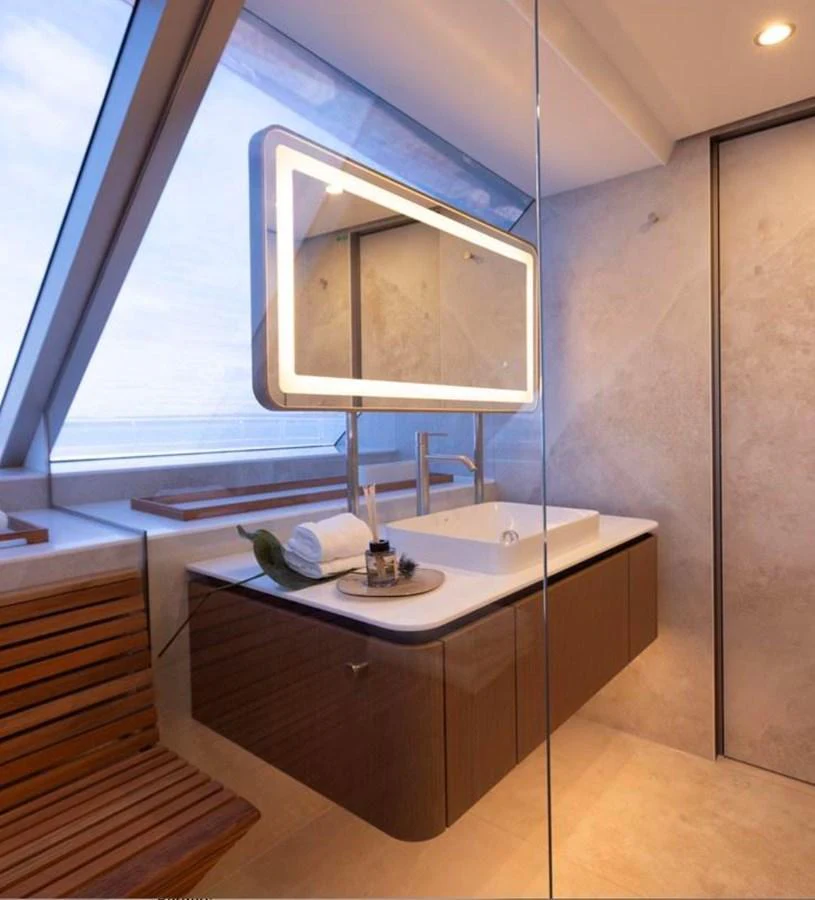 A modern yacht bathroom with sleek fixtures and a large mirror. aboard TWILIGHT Yacht for Sale