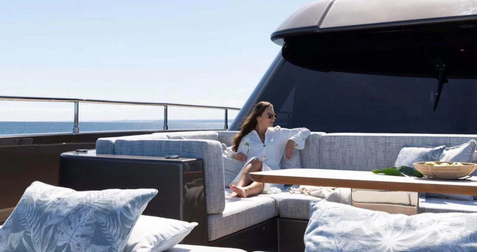 A luxurious sundeck with comfortable seating and a serene ocean view. aboard TWILIGHT Yacht for Sale