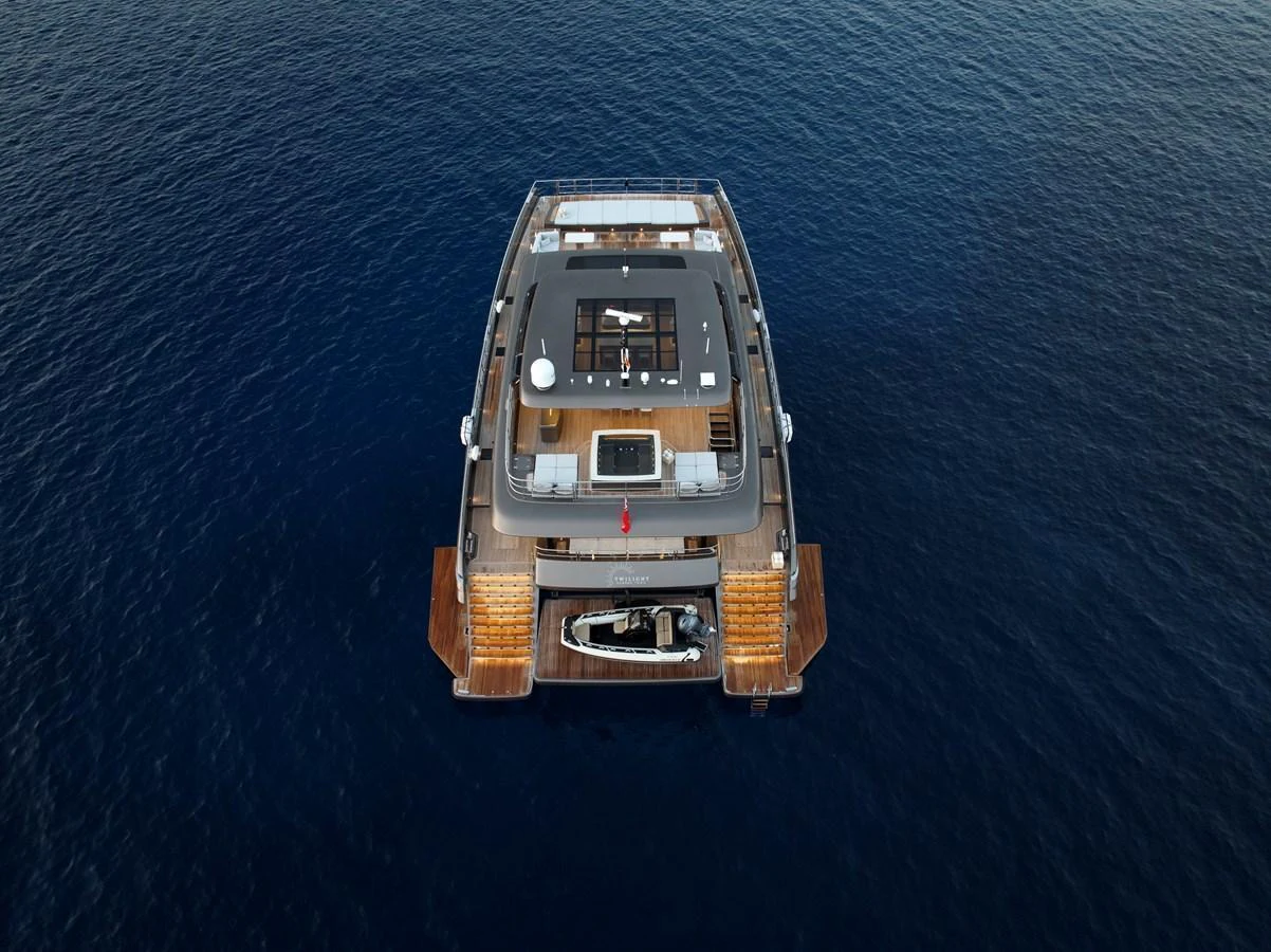 The yacht's aft deck offers a spacious and inviting area for relaxation and water activities. aboard TWILIGHT Yacht for Sale