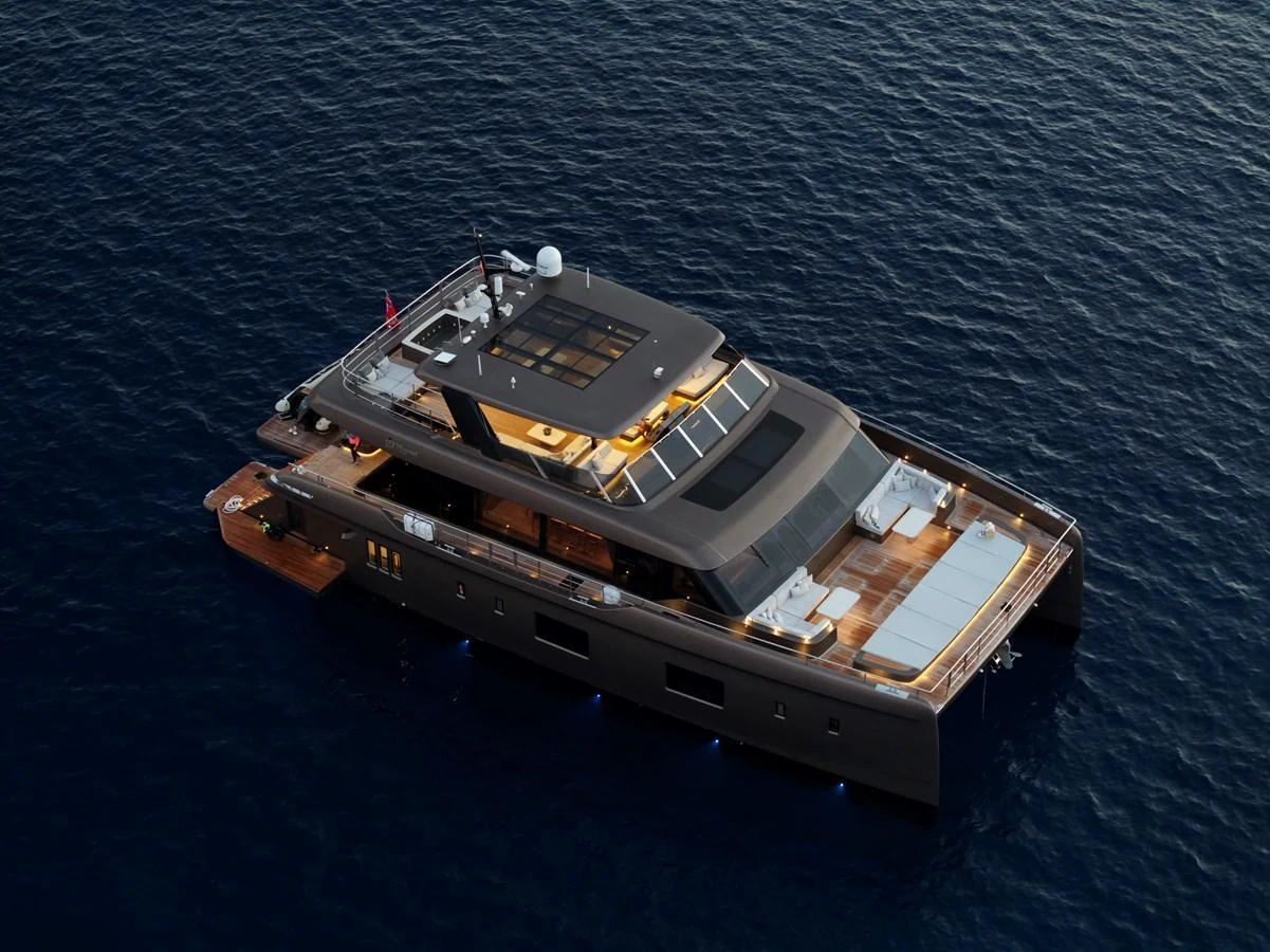 A luxurious yacht with sleek design and spacious decks, cruising on calm waters. aboard TWILIGHT Yacht for Sale