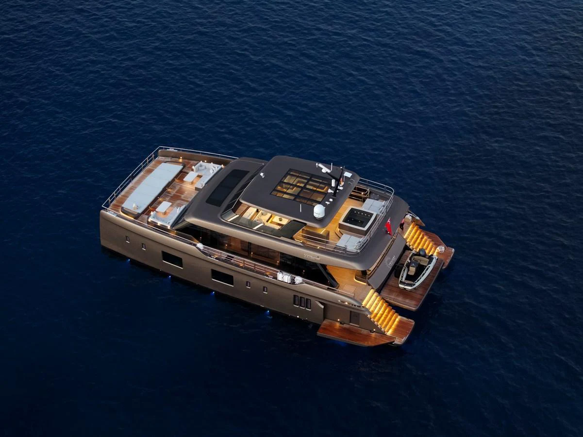 A luxurious yacht floats gracefully on calm blue waters, showcasing its sleek design and spacious decks. aboard TWILIGHT Yacht for Sale