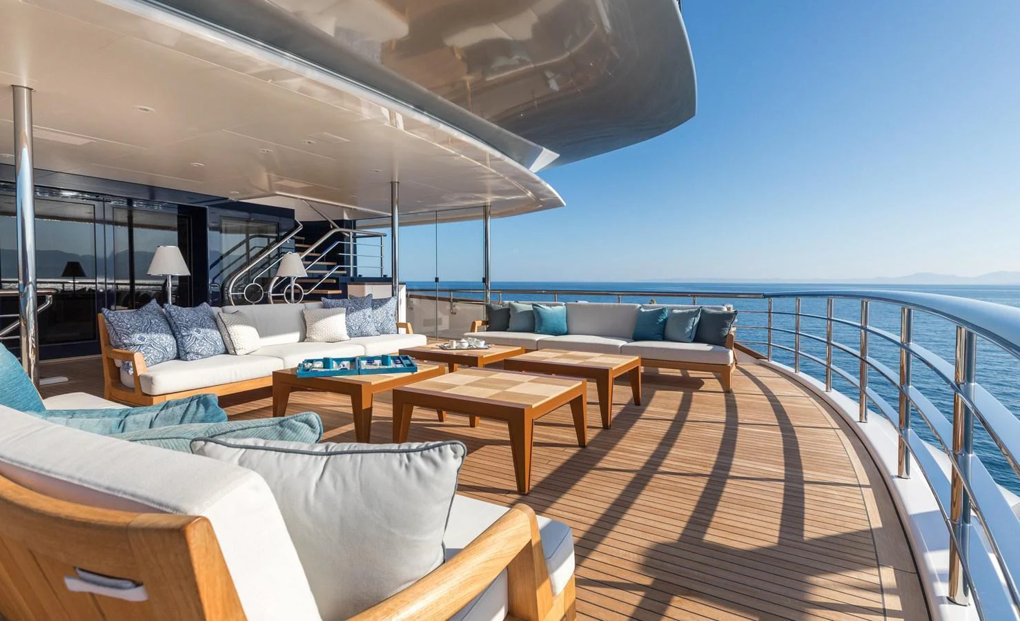 The aft deck offers a luxurious outdoor seating area with stunning ocean views. aboard HAMPSHIRE Yacht for Sale