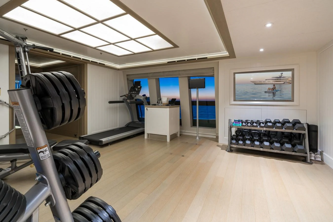 The yacht features a well-equipped gym with modern fitness equipment and a serene view. aboard HAMPSHIRE Yacht for Sale