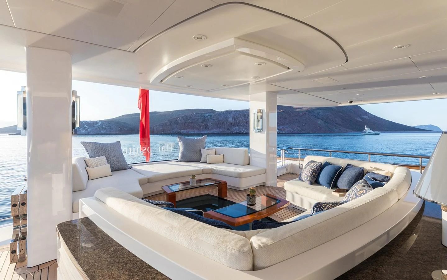 The aft deck features a luxurious seating area with panoramic ocean views. aboard HAMPSHIRE Yacht for Sale