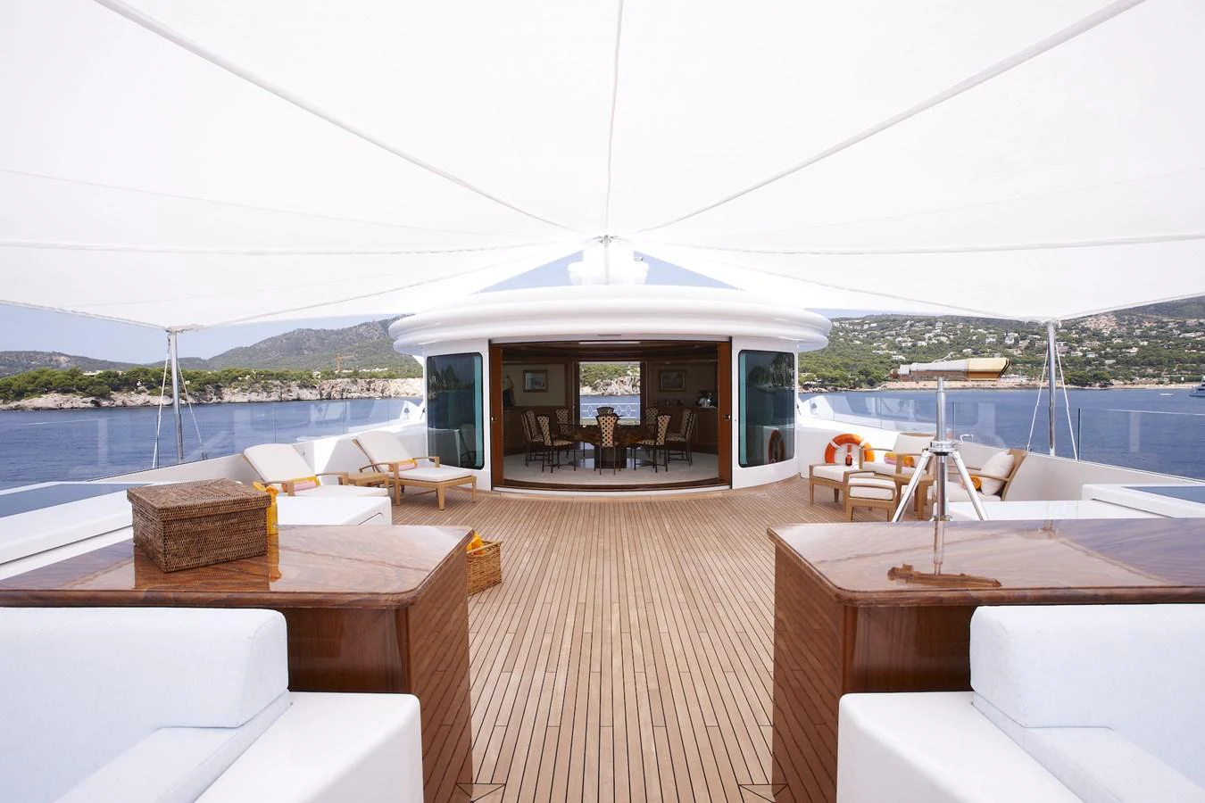 The yacht's sundeck offers a spacious and inviting area with ample seating and stunning views. aboard LADY CHRISTINE Yacht for Sale