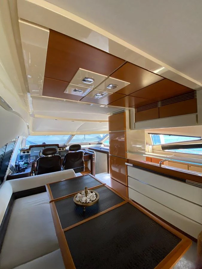 The yacht's helm area features a sleek, modern design with comfortable seating and advanced navigation equipment. aboard NE SEL Yacht for Sale