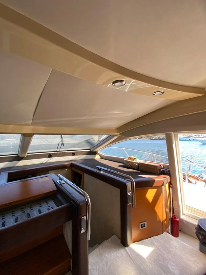 The helm station offers a commanding view with modern navigation equipment and luxurious finishes. aboard NE SEL Yacht for Sale