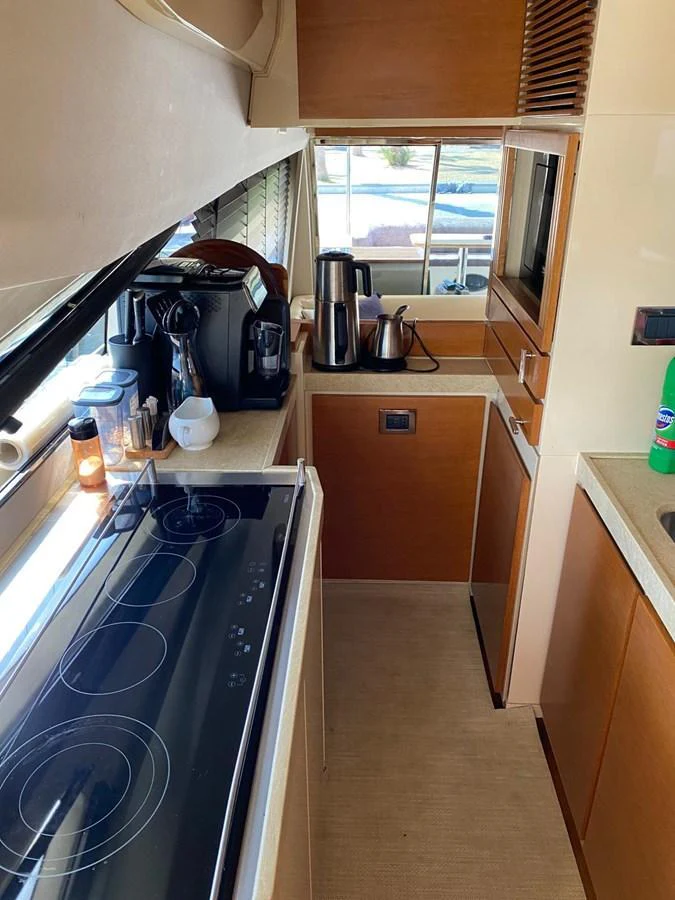 The galley is equipped with modern appliances and ample counter space, perfect for preparing gourmet meals. aboard NE SEL Yacht for Sale