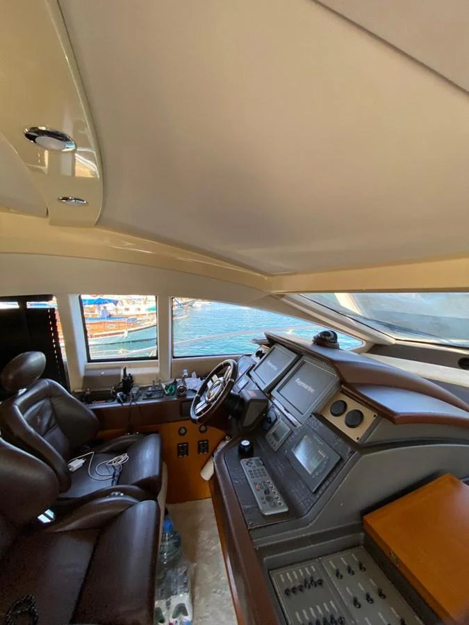 The helm station offers a sophisticated and well-equipped control area with a view of the water. aboard NE SEL Yacht for Sale