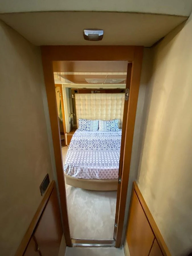 A cozy stateroom with a comfortable bed and elegant decor. aboard NE SEL Yacht for Sale