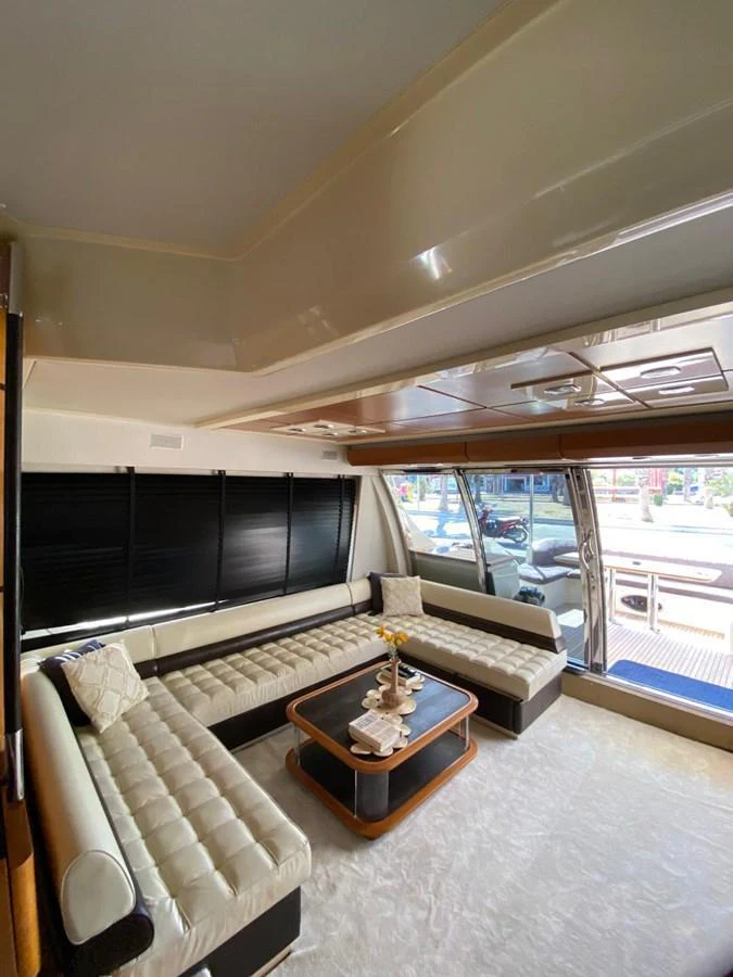The salon features plush seating and a stylish coffee table, creating a comfortable and inviting space. aboard NE SEL Yacht for Sale
