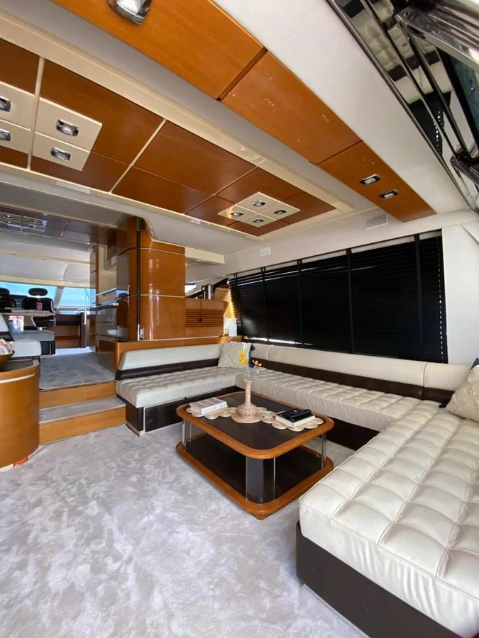 The yacht's salon features a luxurious seating area with plush cushions and a stylish coffee table, creating a comfortable and elegant space for relaxation. aboard NE SEL Yacht for Sale