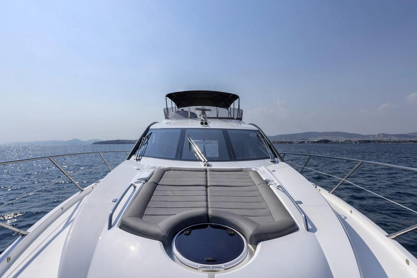 The yacht's sleek foredeck offers a luxurious sunbathing area with stunning sea views. aboard "CORAZON DE LEON" Yacht for Sale