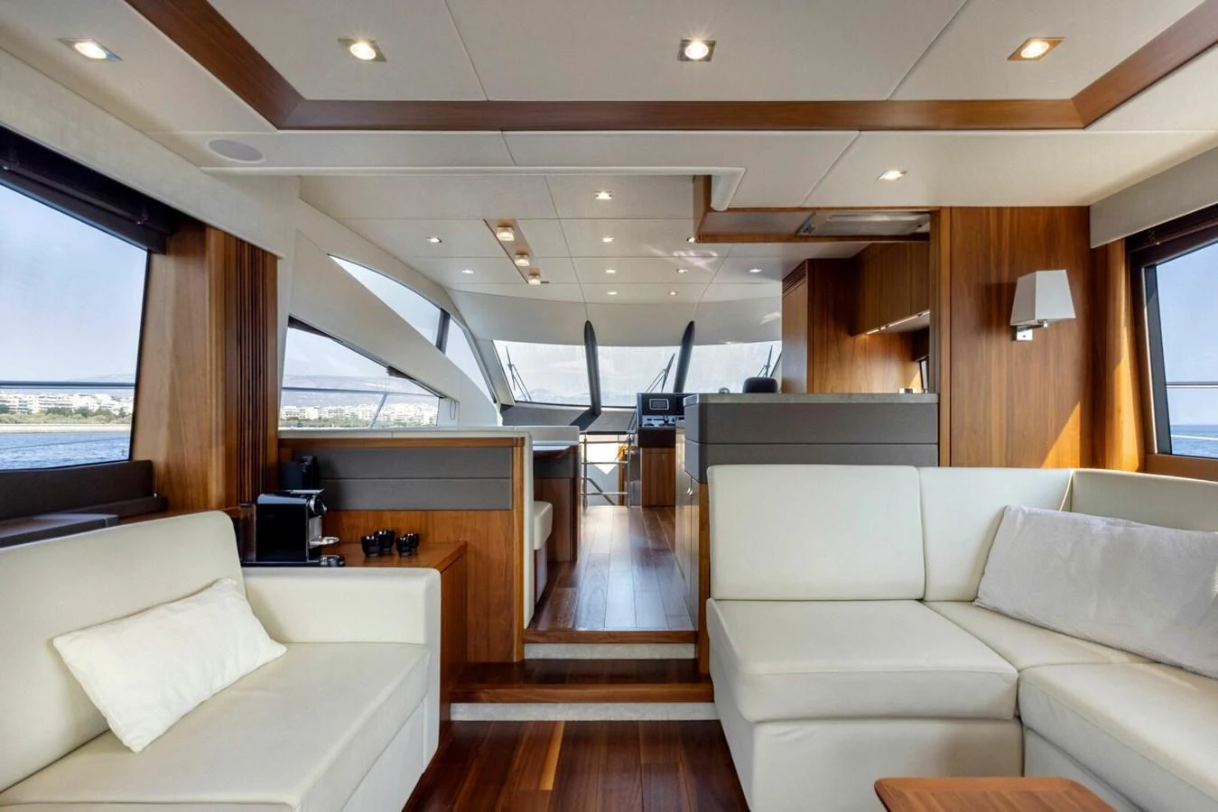 The salon offers a spacious and elegant seating area with panoramic views. aboard "CORAZON DE LEON" Yacht for Sale