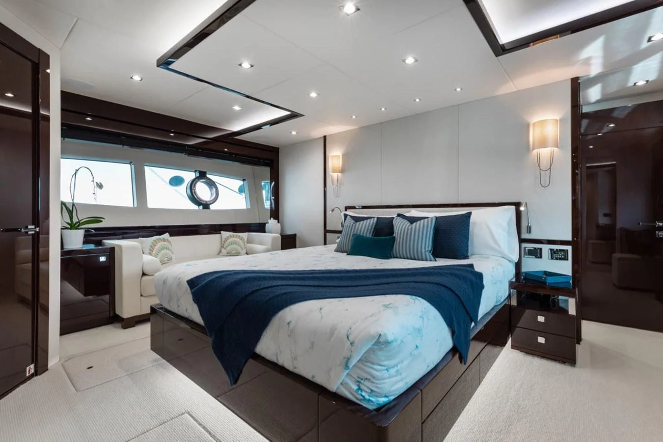The master stateroom features a luxurious bed with elegant bedding and modern decor. aboard 95 FT 2018 SUNSEEKER 95 YACHT, MIRRACLE Yacht for Sale
