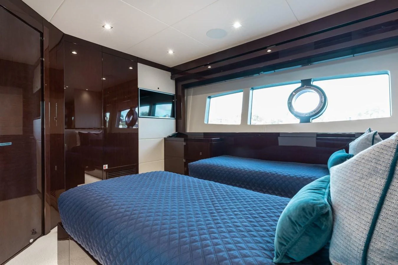 The guest stateroom features twin beds with elegant bedding and ample natural light from large windows. aboard 95 FT 2018 SUNSEEKER 95 YACHT, MIRRACLE Yacht for Sale