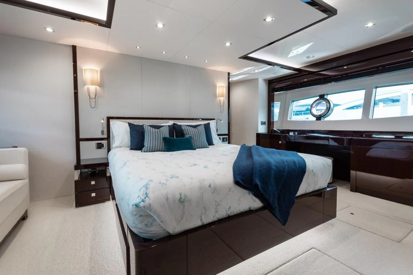 The master stateroom features a luxurious bed with elegant bedding and modern decor. aboard 95 FT 2018 SUNSEEKER 95 YACHT, MIRRACLE Yacht for Sale