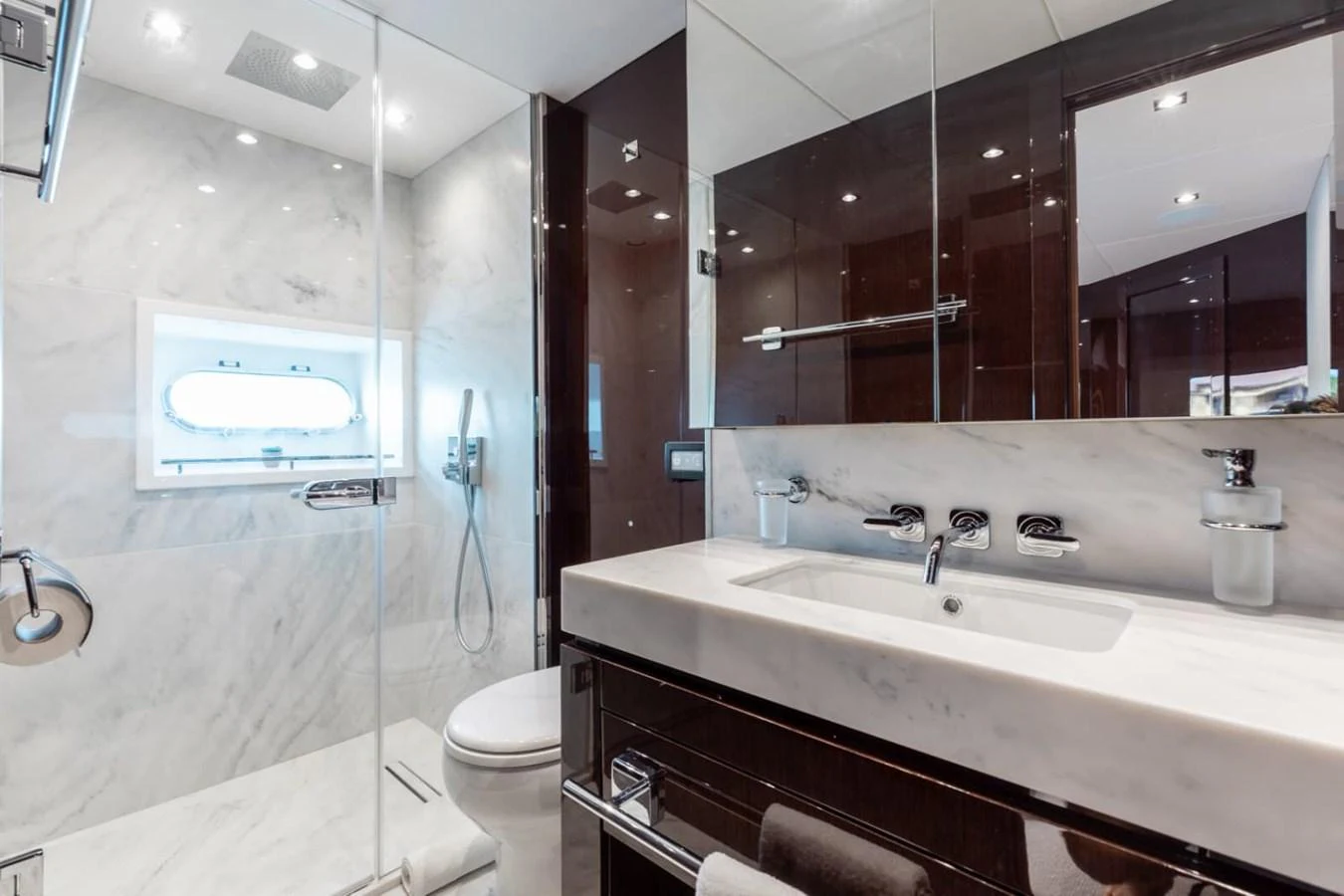 The yacht's bathroom features a sleek design with marble surfaces and modern fixtures. aboard 95 FT 2018 SUNSEEKER 95 YACHT, MIRRACLE Yacht for Sale