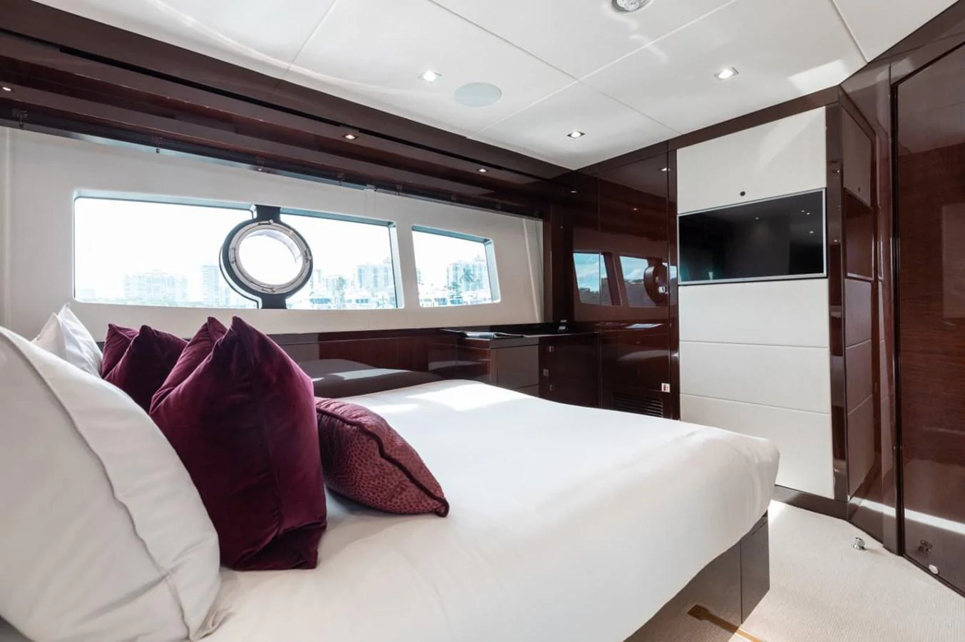 The stateroom features a luxurious bed with plush pillows and ample natural light from large windows. aboard 95 FT 2018 SUNSEEKER 95 YACHT, MIRRACLE Yacht for Sale