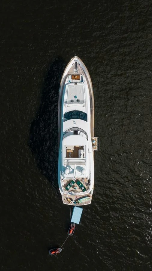 An aerial view of a luxurious yacht cruising on dark waters. aboard 95 FT 2018 SUNSEEKER 95 YACHT, MIRRACLE Yacht for Sale