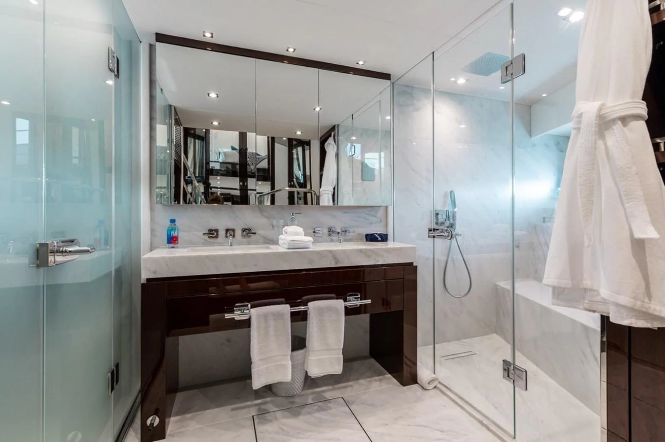 The yacht's bathroom features a sleek design with a spacious shower and elegant fixtures. aboard 95 FT 2018 SUNSEEKER 95 YACHT, MIRRACLE Yacht for Sale
