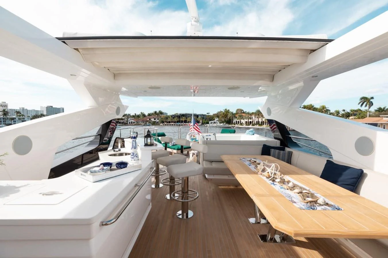 The flybridge offers a spacious and luxurious outdoor living area with ample seating and dining options. aboard 95 FT 2018 SUNSEEKER 95 YACHT, MIRRACLE Yacht for Sale