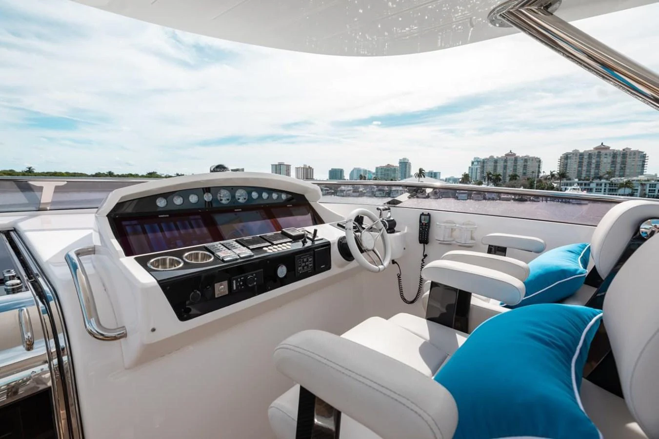 The helm station offers a sleek and modern control area with comfortable seating and advanced navigation equipment. aboard 95 FT 2018 SUNSEEKER 95 YACHT, MIRRACLE Yacht for Sale