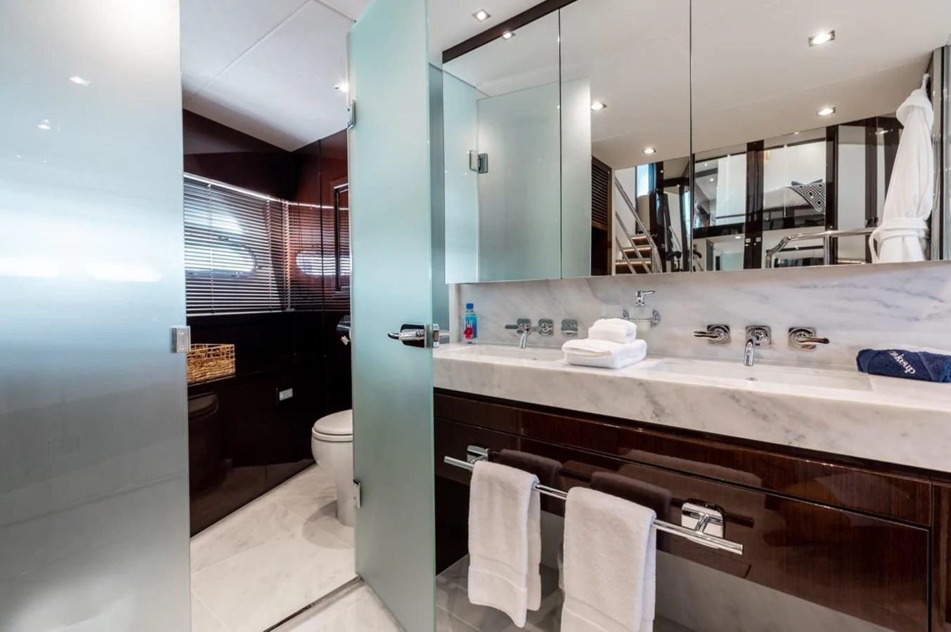 The yacht's bathroom features a sleek design with modern fixtures and ample lighting. aboard 95 FT 2018 SUNSEEKER 95 YACHT, MIRRACLE Yacht for Sale