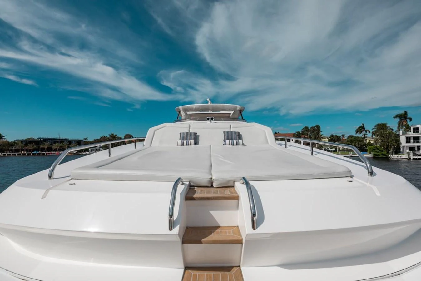 The yacht's foredeck features spacious sun pads under a beautiful blue sky. aboard 95 FT 2018 SUNSEEKER 95 YACHT, MIRRACLE Yacht for Sale