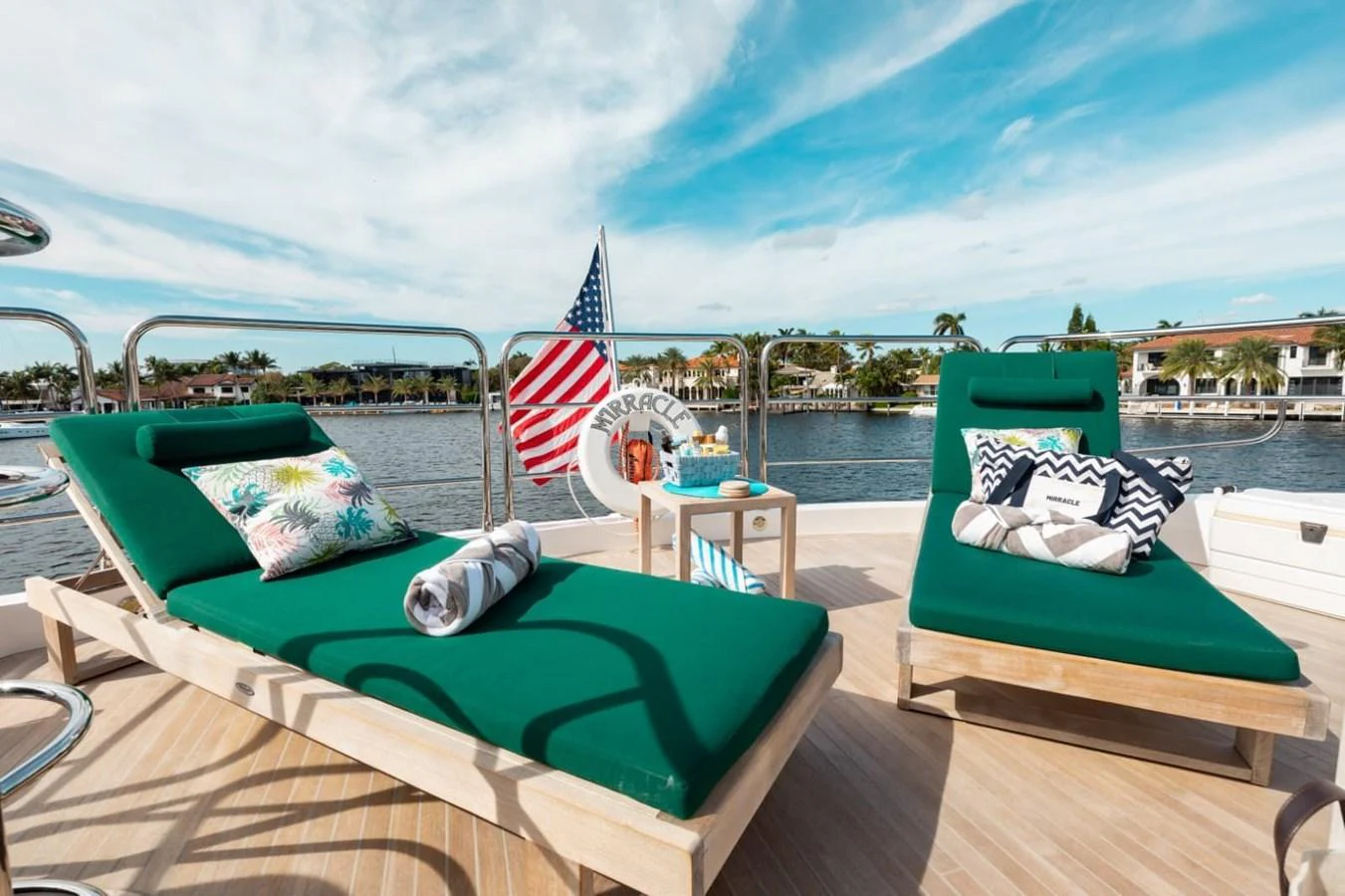 The sundeck features comfortable lounge chairs with vibrant cushions, perfect for relaxation under the sun. aboard 95 FT 2018 SUNSEEKER 95 YACHT, MIRRACLE Yacht for Sale
