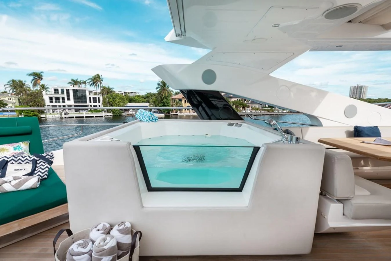 A luxurious jacuzzi on the deck offers a perfect spot for relaxation with a scenic waterfront view. aboard 95 FT 2018 SUNSEEKER 95 YACHT, MIRRACLE Yacht for Sale