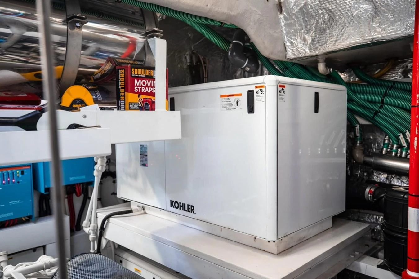 The image showcases the yacht's engine room with a Kohler generator and various mechanical components. aboard 95 FT 2018 SUNSEEKER 95 YACHT, MIRRACLE Yacht for Sale