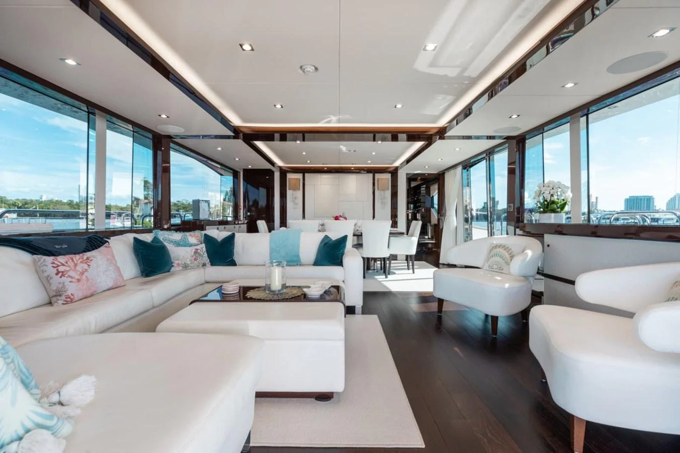 The salon features luxurious seating with panoramic views through large windows. aboard 95 FT 2018 SUNSEEKER 95 YACHT, MIRRACLE Yacht for Sale