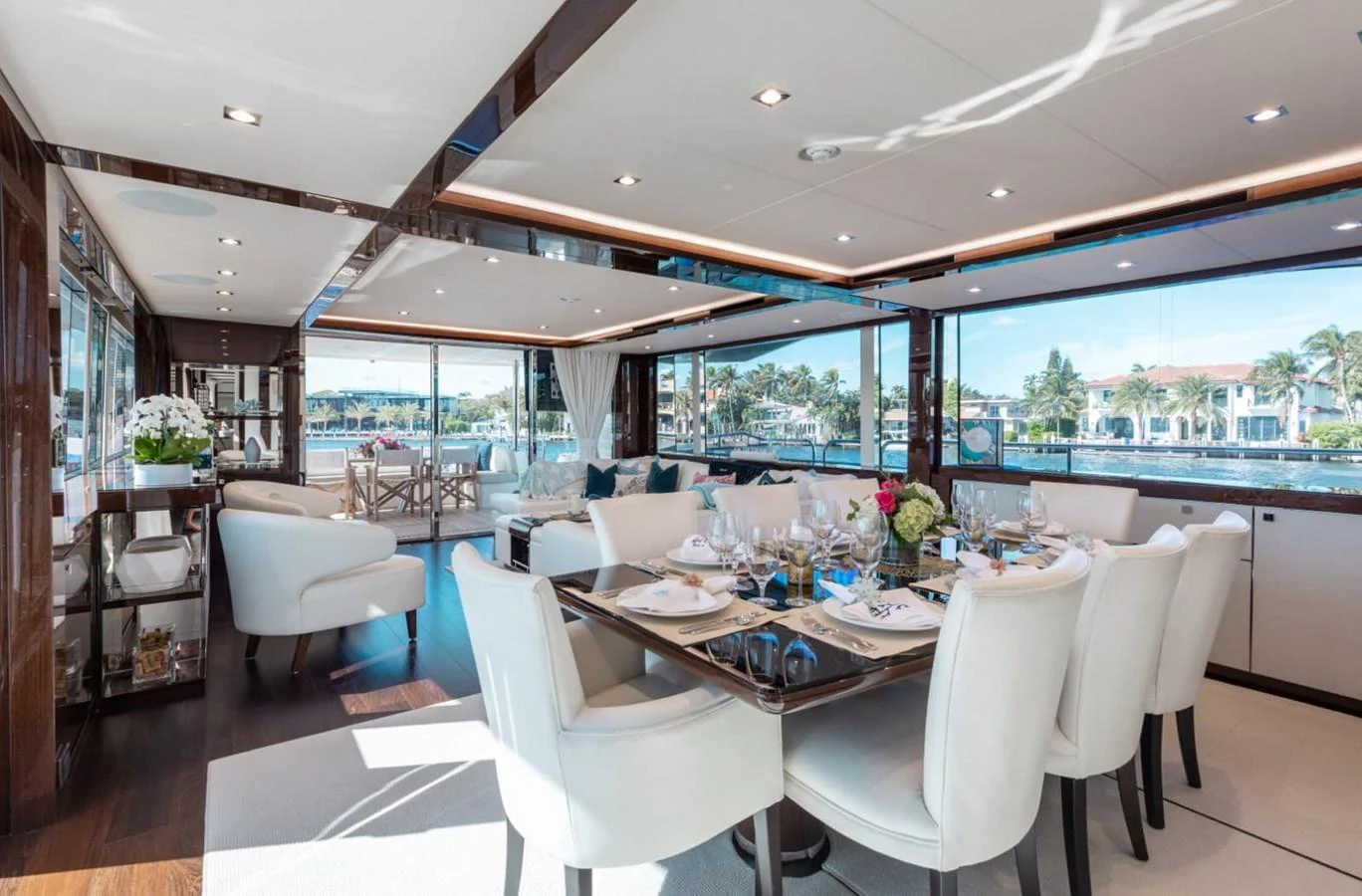 The yacht's dining area features elegant furnishings and expansive windows offering stunning views. aboard 95 FT 2018 SUNSEEKER 95 YACHT, MIRRACLE Yacht for Sale