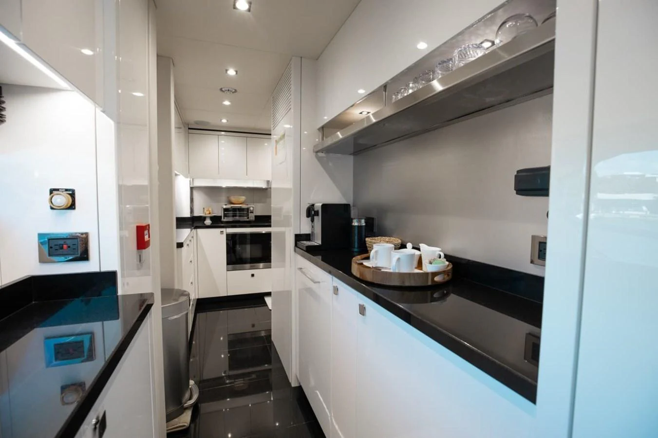 The sleek and modern galley is equipped with high-end appliances and ample counter space for gourmet meal preparation. aboard 95 FT 2018 SUNSEEKER 95 YACHT, MIRRACLE Yacht for Sale