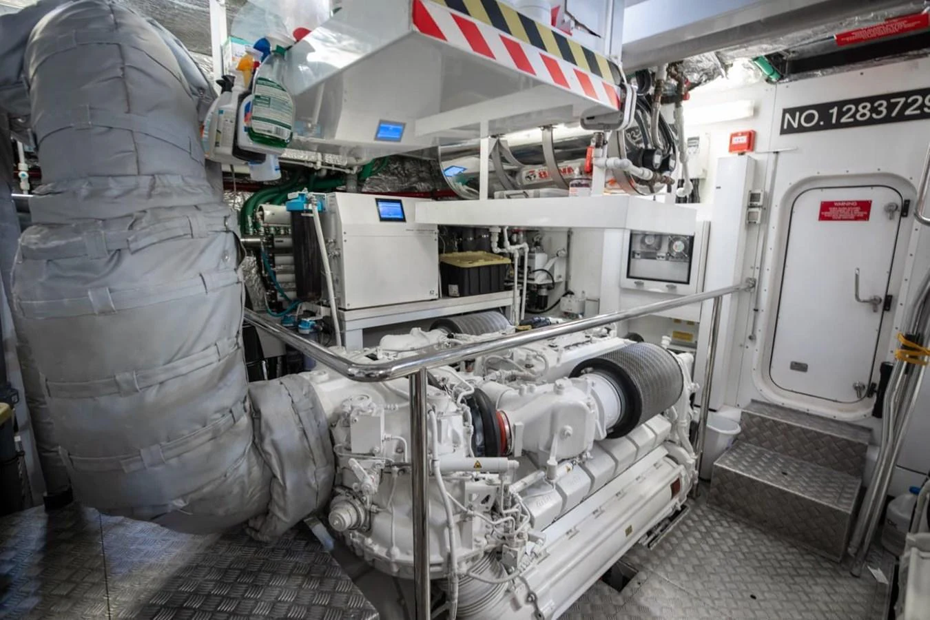 The image showcases the yacht's well-maintained engine room with advanced machinery and equipment. aboard 95 FT 2018 SUNSEEKER 95 YACHT, MIRRACLE Yacht for Sale