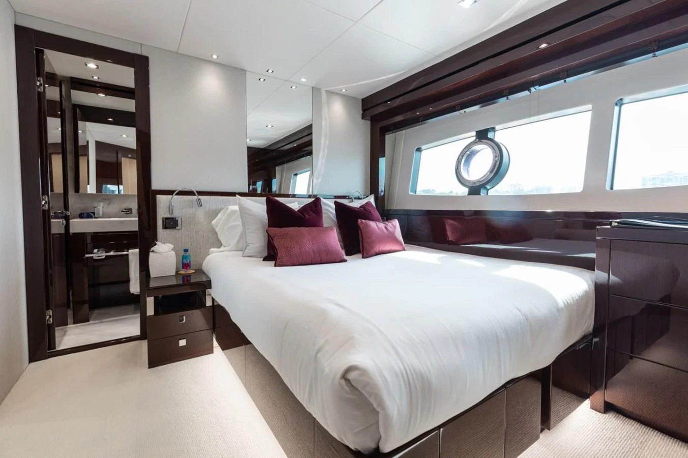 The stateroom features a luxurious bed with plush pillows and ample natural light from large windows. aboard 95 FT 2018 SUNSEEKER 95 YACHT, MIRRACLE Yacht for Sale