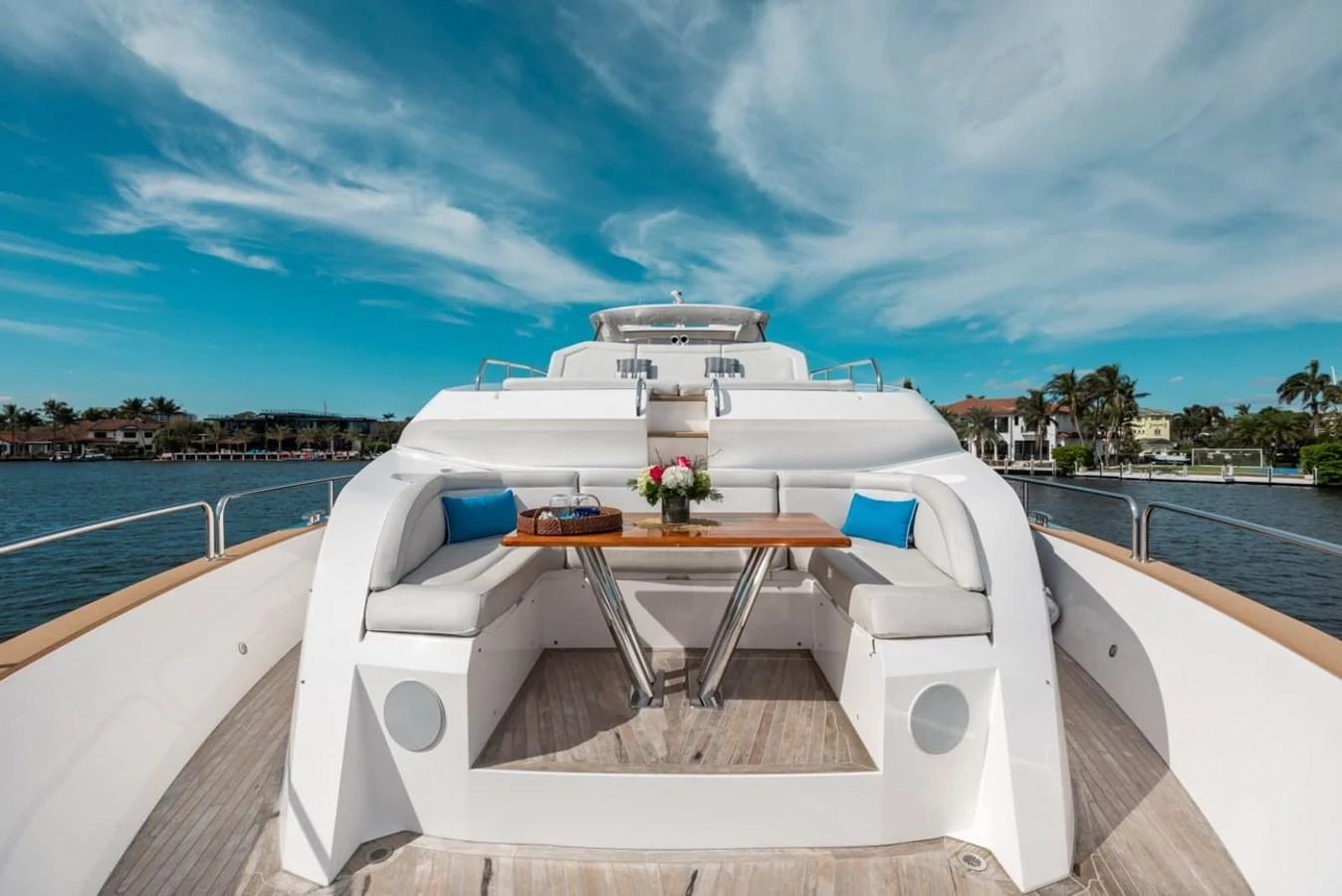 The flybridge offers a spacious seating area with a wooden table, perfect for outdoor dining and relaxation. aboard 95 FT 2018 SUNSEEKER 95 YACHT, MIRRACLE Yacht for Sale